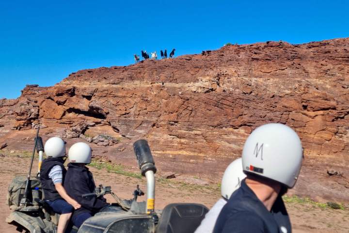 a man with a helmet on a rocky hill