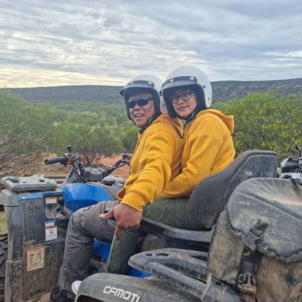 a man sitting on top of a mountain