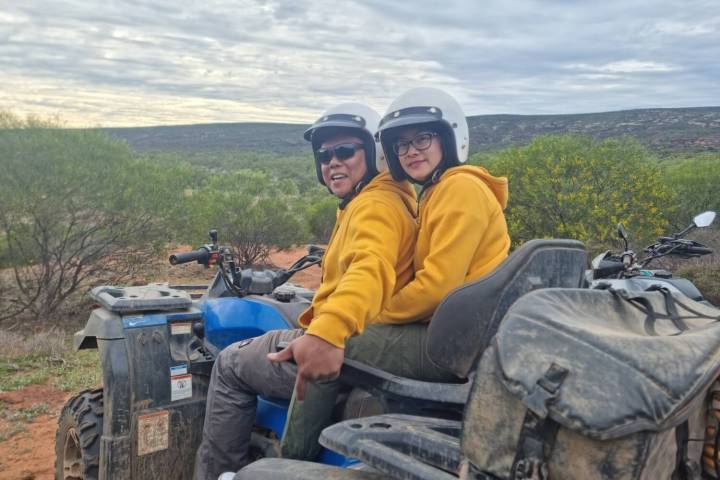 a man sitting on top of a mountain