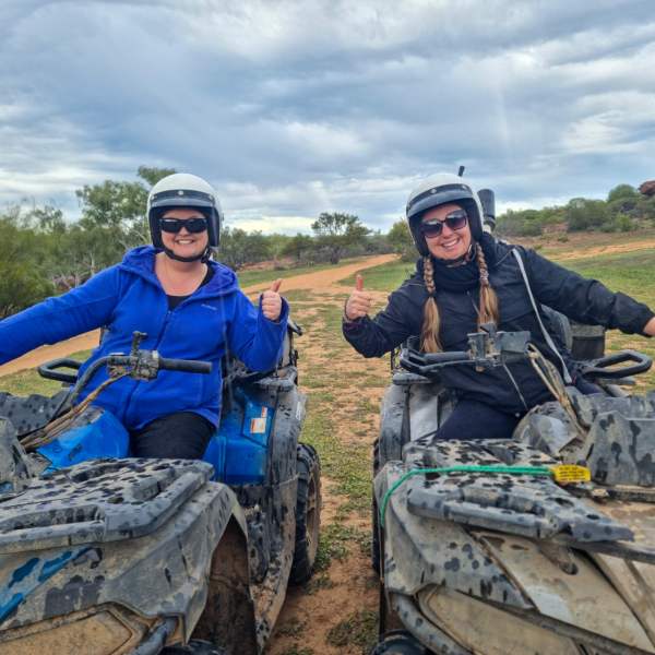 a group of people riding on the back of a truck