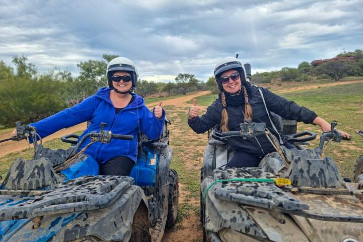 a group of people riding on the back of a truck